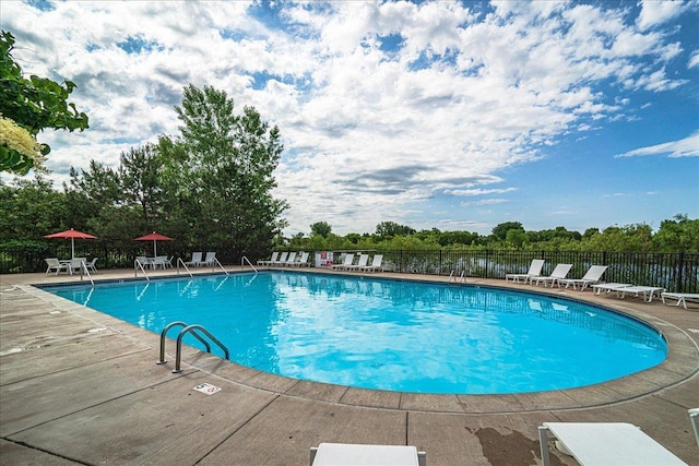 4363 Victor Path Unit 7, Hugo, MN 55038 - community pool featuring a patio area and view of scattered trees
