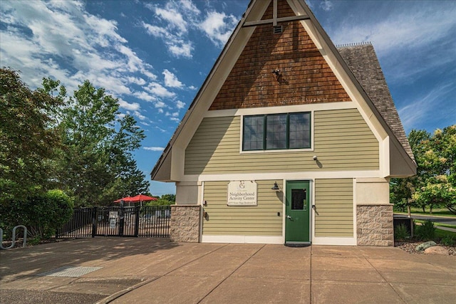 4363 Victor Path Unit 7, Hugo, MN 55038 - view of front facade with stone siding and a patio area