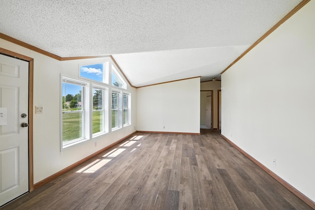 6257 State Highway 70, Rock Creek, MN 55063 - unfurnished living room with wood finished floors, vaulted ceiling, crown molding, and a textured ceiling