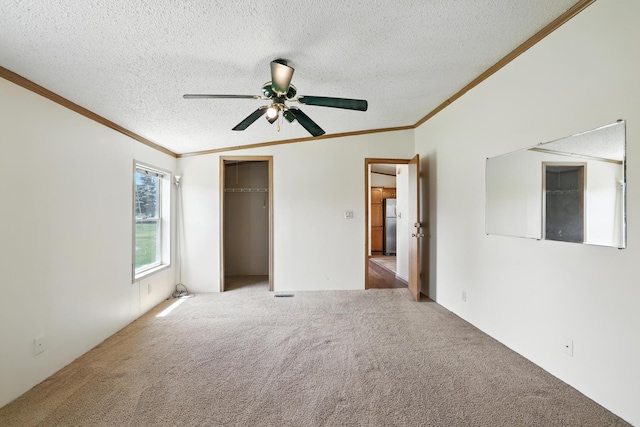 6257 State Highway 70, Rock Creek, MN 55063 - unfurnished bedroom with crown molding, carpet, a textured ceiling, freestanding refrigerator, and a closet