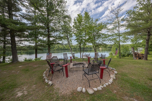 1618 Maple Shores Ln NE, Longville, MN 56655 - view of green lawn with an outdoor fire pit and a water view