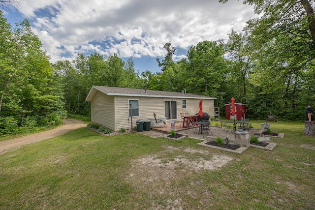 1618 Maple Shores Ln NE, Longville, MN 56655 - back of property featuring a yard and a patio area