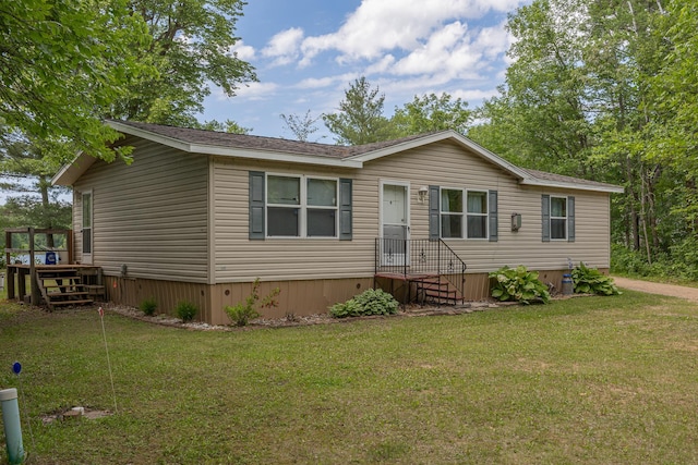 1618 Maple Shores Ln NE, Longville, MN 56655 - manufactured / mobile home with a front yard and a wooden deck