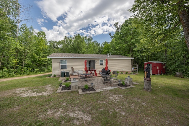 1618 Maple Shores Ln NE, Longville, MN 56655 - rear view of house with a patio area and a yard