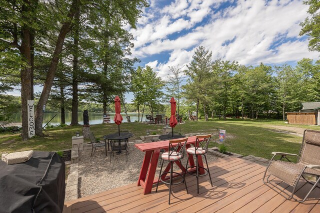 1618 Maple Shores Ln NE, Longville, MN 56655 - deck with a lawn, a water view, and outdoor dining area
