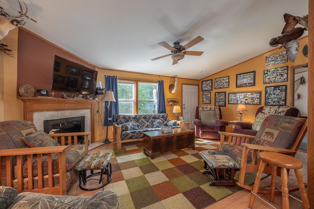1618 Maple Shores Ln NE, Longville, MN 56655 - living area featuring ceiling fan, a tile fireplace, lofted ceiling, and wood finished floors