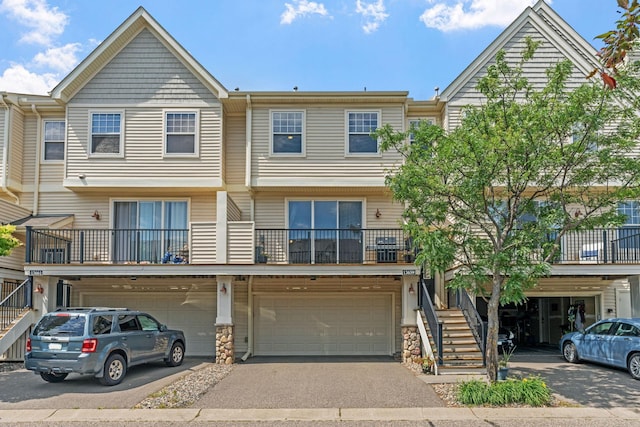 13659 Brick Path, Rosemount, MN 55068 - multi unit property featuring stairs, driveway, a garage, and stone siding