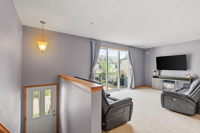 13659 Brick Path, Rosemount, MN 55068 - carpeted living area with a textured ceiling and a glass covered fireplace