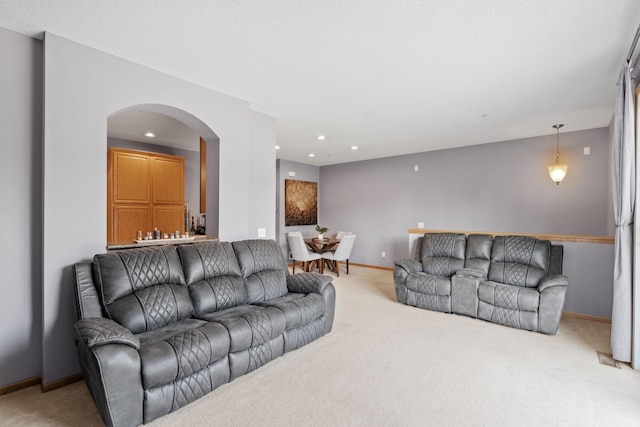 13659 Brick Path, Rosemount, MN 55068 - living area with arched walkways, light colored carpet, recessed lighting, and bar