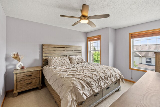 13659 Brick Path, Rosemount, MN 55068 - bedroom featuring carpet flooring, a textured ceiling, and a ceiling fan