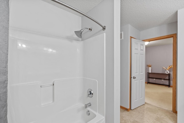 13659 Brick Path, Rosemount, MN 55068 - bathroom featuring a textured ceiling,  shower combination, and tile patterned flooring