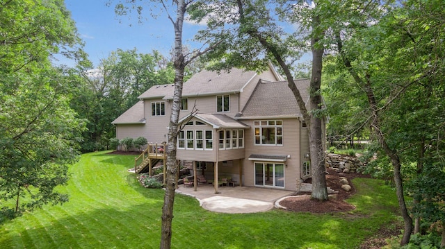 3027 135th Ave NE, Ham Lake, MN 55304 - rear view of property featuring a patio area, a lawn, stairs, a deck, and a shingled roof