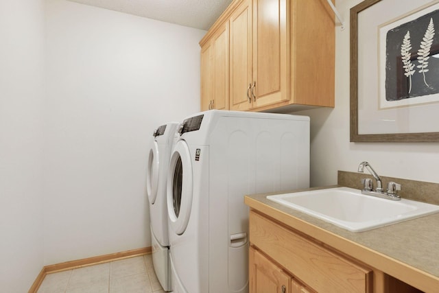 3027 135th Ave NE, Ham Lake, MN 55304 - washroom with washing machine and dryer, cabinet space, and light tile patterned floors