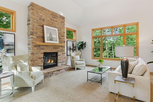 3027 135th Ave NE, Ham Lake, MN 55304 - living area featuring a fireplace, healthy amount of natural light, carpet flooring, and vaulted ceiling