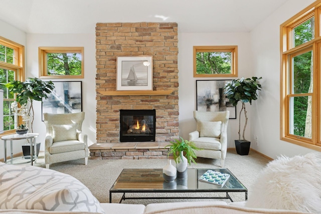 3027 135th Ave NE, Ham Lake, MN 55304 - carpeted living room featuring baseboards and a fireplace