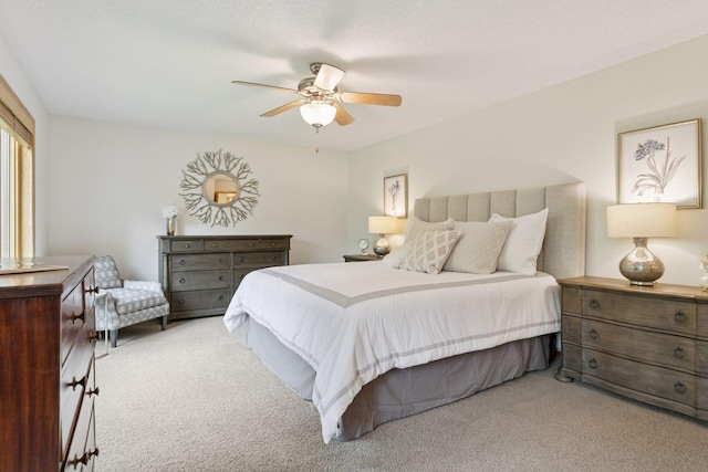 3027 135th Ave NE, Ham Lake, MN 55304 - bedroom with light colored carpet and a ceiling fan