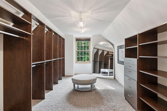 3027 135th Ave NE, Ham Lake, MN 55304 - walk in closet featuring light carpet, a chandelier, and vaulted ceiling