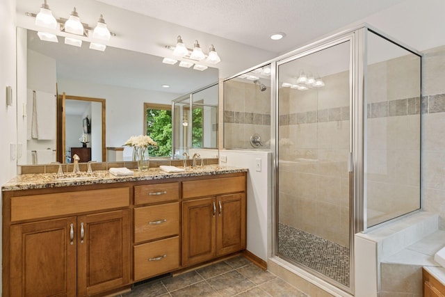3027 135th Ave NE, Ham Lake, MN 55304 - bathroom with double vanity, a stall shower, a garden tub, tile patterned flooring, and recessed lighting
