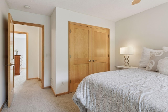 3027 135th Ave NE, Ham Lake, MN 55304 - bedroom featuring light carpet, a closet, and ceiling fan