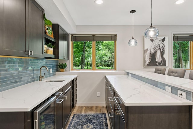 3027 135th Ave NE, Ham Lake, MN 55304 - kitchen with beverage cooler, light wood-style floors, plenty of natural light, open shelves, and recessed lighting