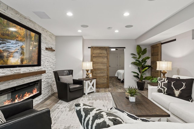 3027 135th Ave NE, Ham Lake, MN 55304 - living room with wood finished floors, recessed lighting, and a fireplace