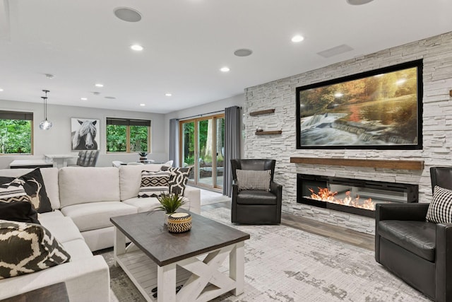 3027 135th Ave NE, Ham Lake, MN 55304 - living room with a fireplace, recessed lighting, plenty of natural light, and wood finished floors