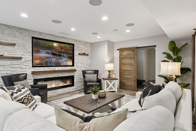 3027 135th Ave NE, Ham Lake, MN 55304 - living room with wood finished floors, recessed lighting, and a stone fireplace