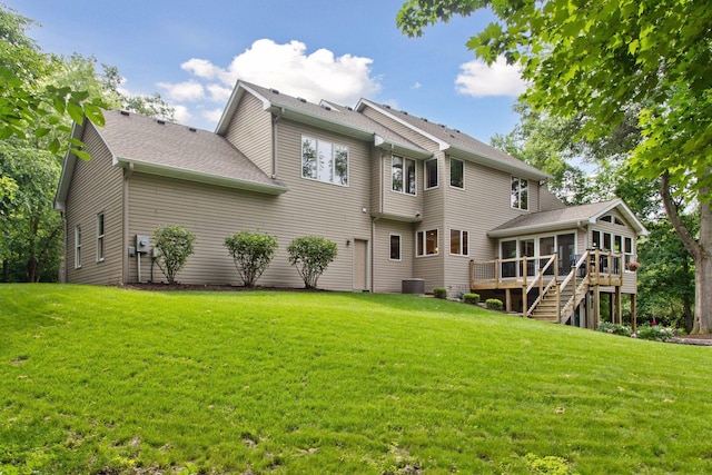 3027 135th Ave NE, Ham Lake, MN 55304 - back of property with a sunroom, a lawn, and stairs