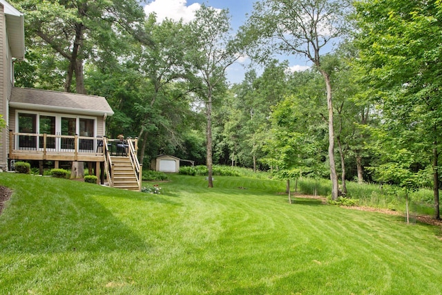 3027 135th Ave NE, Ham Lake, MN 55304 - view of green lawn featuring stairs, an outdoor structure, a garage, and a deck