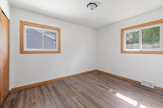 5738 Yates Ave N, Crystal, MN 55429 - spare room featuring wood finished floors and baseboards