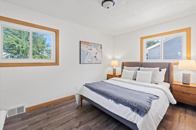 5738 Yates Ave N, Crystal, MN 55429 - bedroom with wood finished floors and a textured ceiling