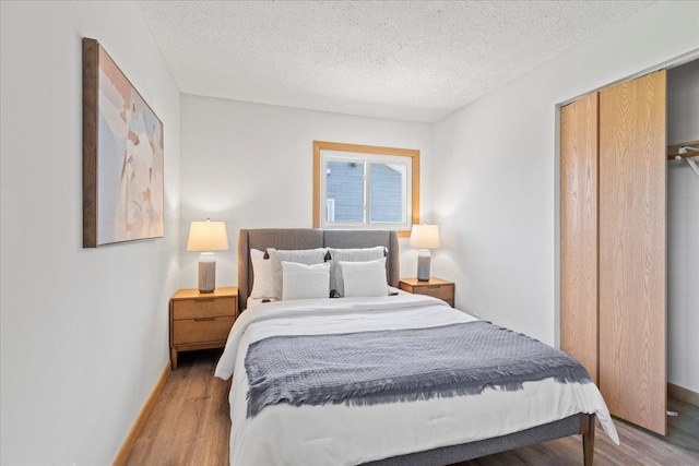 5738 Yates Ave N, Crystal, MN 55429 - bedroom featuring light wood-type flooring and a textured ceiling