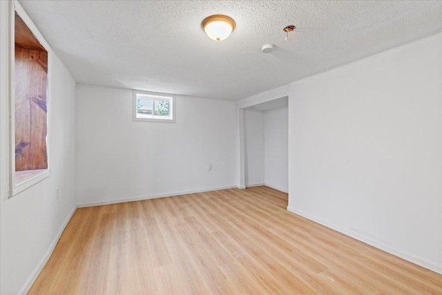 5738 Yates Ave N, Crystal, MN 55429 - unfurnished room featuring light wood-style floors and a textured ceiling