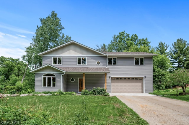 2117 Oakridge St, Saint Paul, MN 55119 - view of front of home with a garage, driveway, a porch, a front yard, and roof with shingles