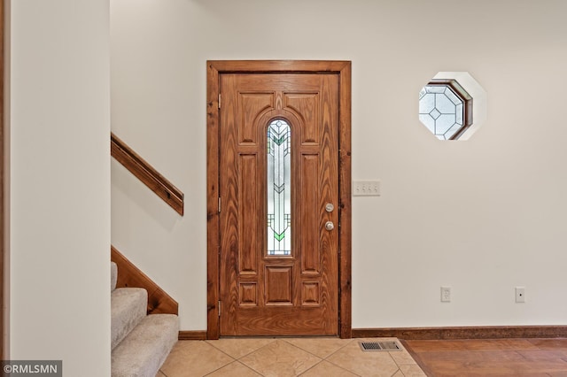 2117 Oakridge St, Saint Paul, MN 55119 - entrance foyer featuring stairs and light tile patterned flooring