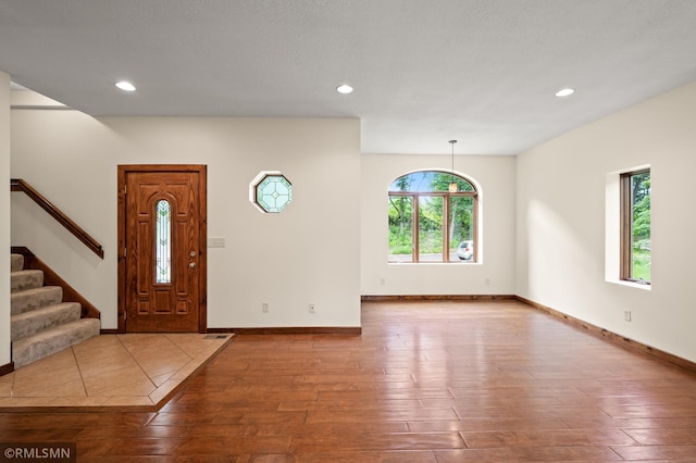 2117 Oakridge St, Saint Paul, MN 55119 - entryway with hardwood / wood-style floors, stairs, and recessed lighting