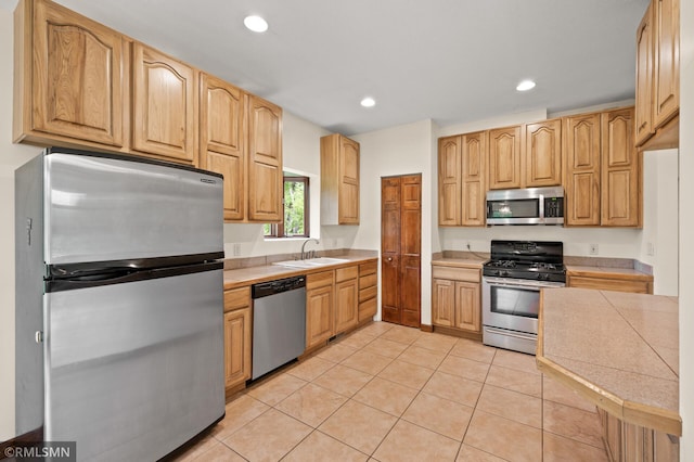 2117 Oakridge St, Saint Paul, MN 55119 - kitchen featuring appliances with stainless steel finishes, light tile patterned floors, light countertops, and recessed lighting