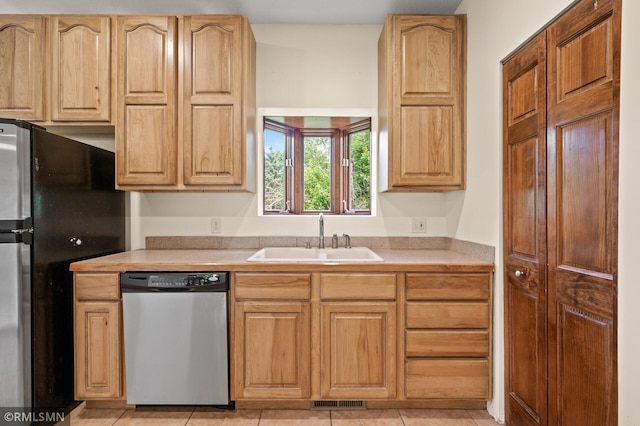 2117 Oakridge St, Saint Paul, MN 55119 - kitchen with appliances with stainless steel finishes, light countertops, and light brown cabinetry