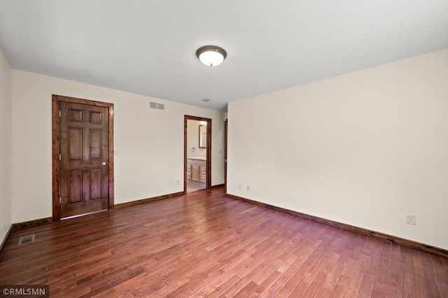 2117 Oakridge St, Saint Paul, MN 55119 - unfurnished bedroom featuring wood finished floors and baseboards