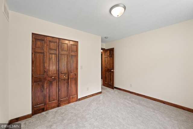 2117 Oakridge St, Saint Paul, MN 55119 - unfurnished bedroom with carpet floors and a closet