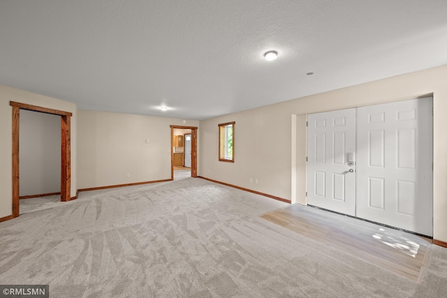 2117 Oakridge St, Saint Paul, MN 55119 - unfurnished bedroom with carpet flooring and a textured ceiling