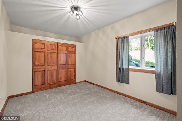 2117 Oakridge St, Saint Paul, MN 55119 - unfurnished bedroom featuring carpet and a closet