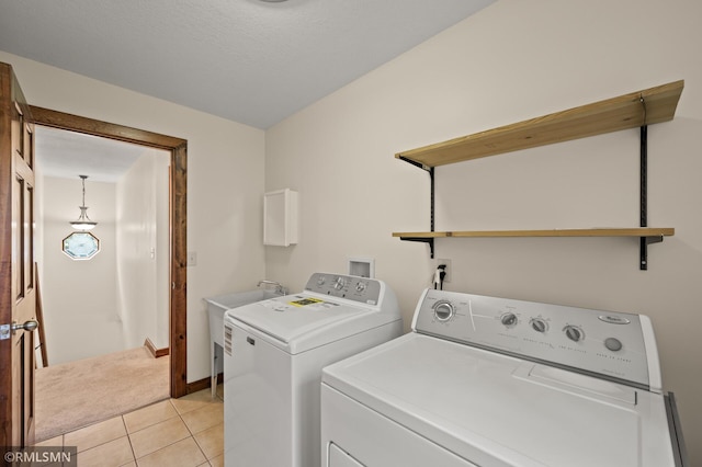 2117 Oakridge St, Saint Paul, MN 55119 - laundry room with washing machine and dryer and light tile patterned flooring