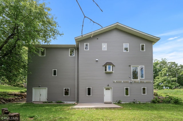 2117 Oakridge St, Saint Paul, MN 55119 - back of property with a patio area and a yard