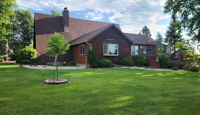 511 4th St W, Jasper, MN 56144 - view of front facade with a front yard and a chimney