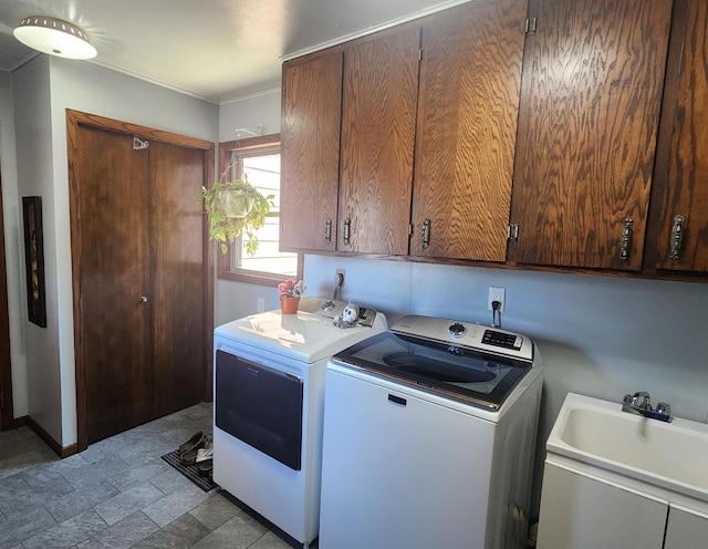 511 4th St W, Jasper, MN 56144 - laundry room featuring independent washer and dryer and cabinet space