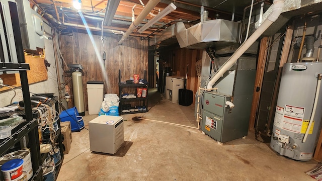 511 4th St W, Jasper, MN 56144 - unfinished below grade area with water heater, heating unit, and a water softener