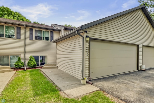 2744 32nd St S, Moorhead, MN 56560 - view of front of property featuring an attached garage and driveway