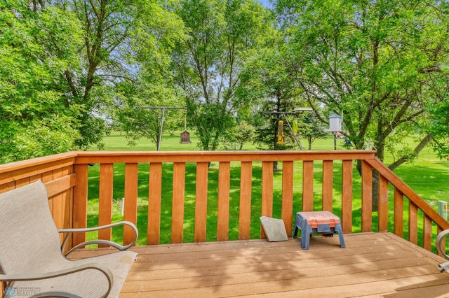 2744 32nd St S, Moorhead, MN 56560 - wooden deck featuring a yard and view of wooded area