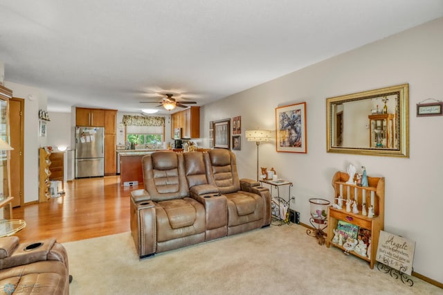 2744 32nd St S, Moorhead, MN 56560 - living room featuring a ceiling fan and light wood-style floors